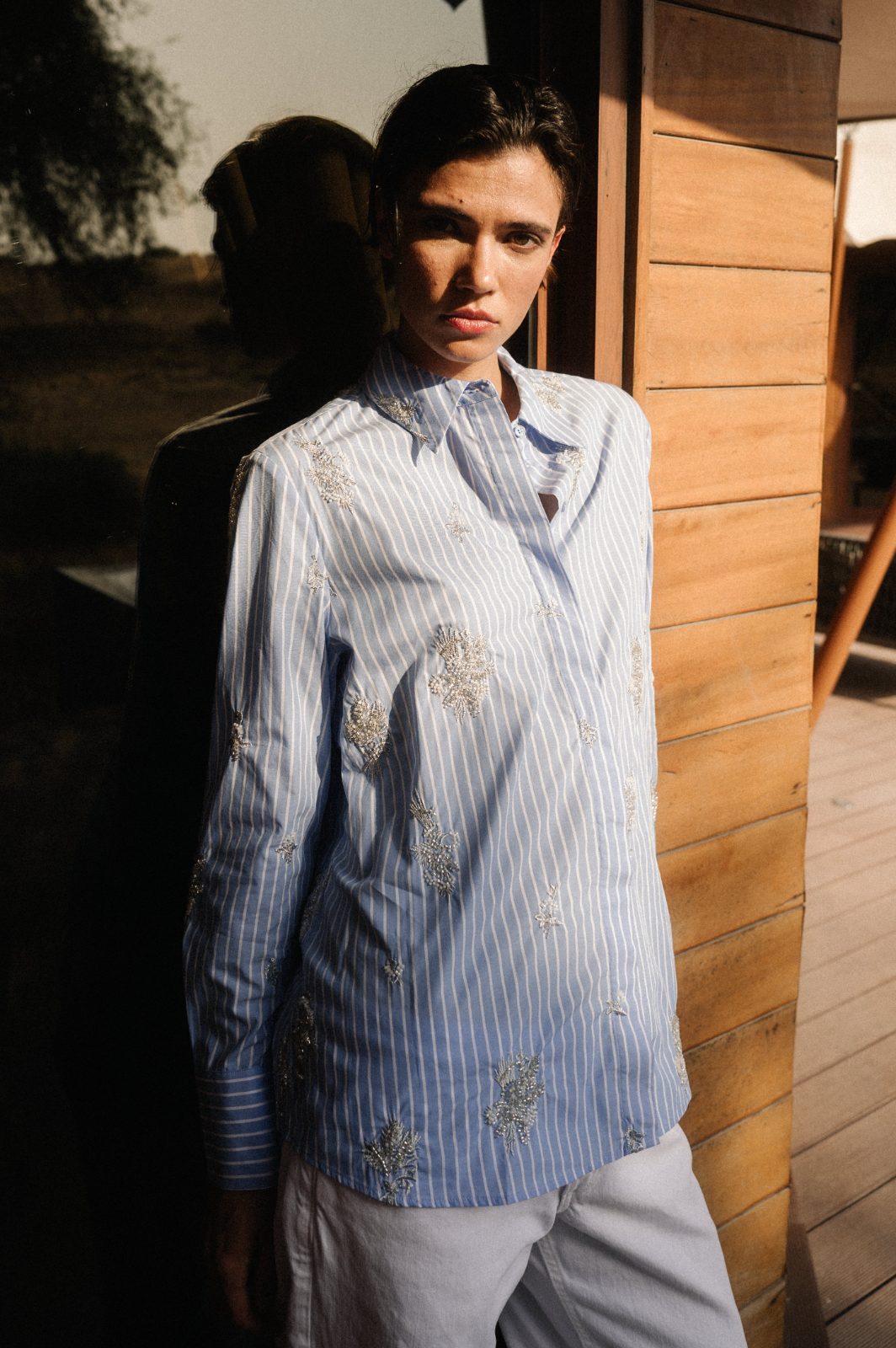 Embellished cotton against the wood